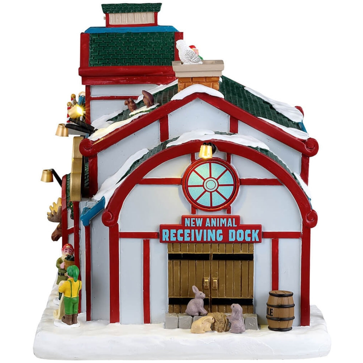 Resin lighted building for a Lemax display. Designed to look like a snow covered animal sanctuary. There are elves everywhere helping with the animals and helping to decorate a Christmas tree on the balcony.