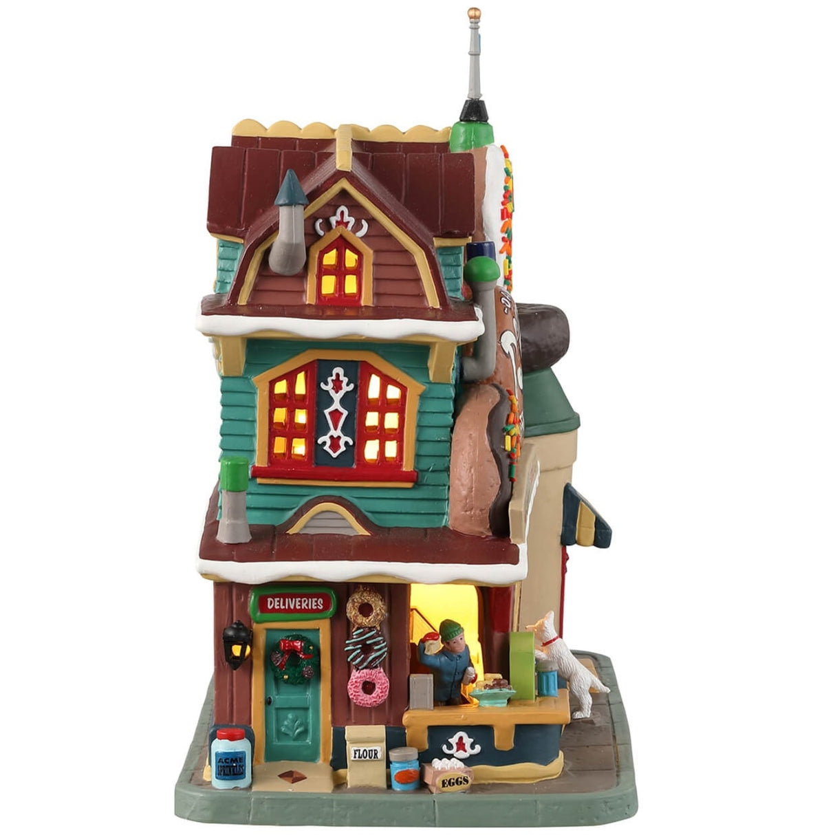 Porcelain lighted building for a Lemax display. Designed to look like a donut shop. There are multiple, large donut statues in front. There's a dog looking in the window at all the treats inside. There's also a vendor behind the booth waving to get your attention.