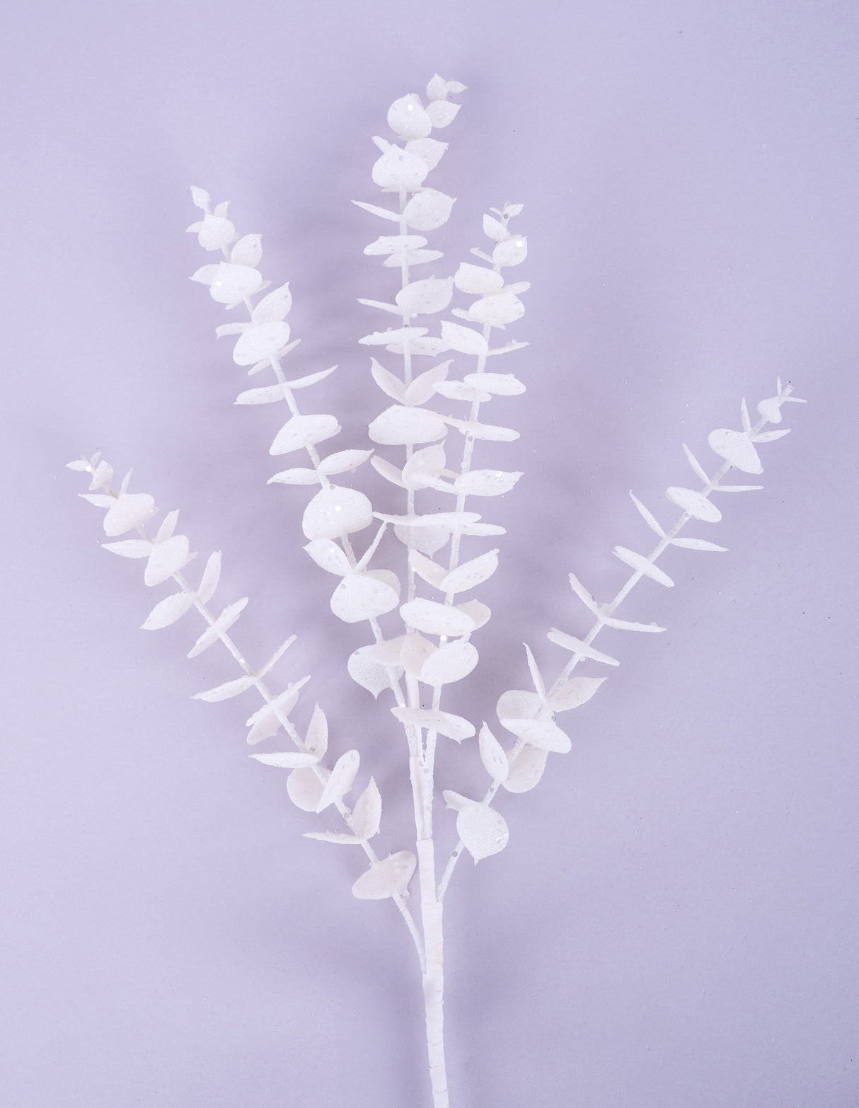 Pick spray designed to look like a eucalyptus stem with leaves. It's decorated with white glitter.