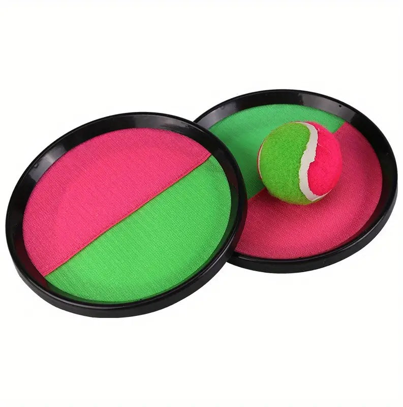 This image shows the Velcro paddles and the soft ball stuck to one of the paddles.