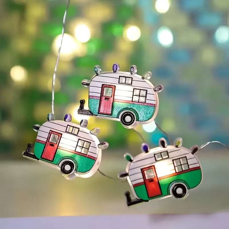 This is a lifestyle image showing the camper lights. The campers are white, red and green. They have red doors, two windows and multi-colored "lights" on the roof.