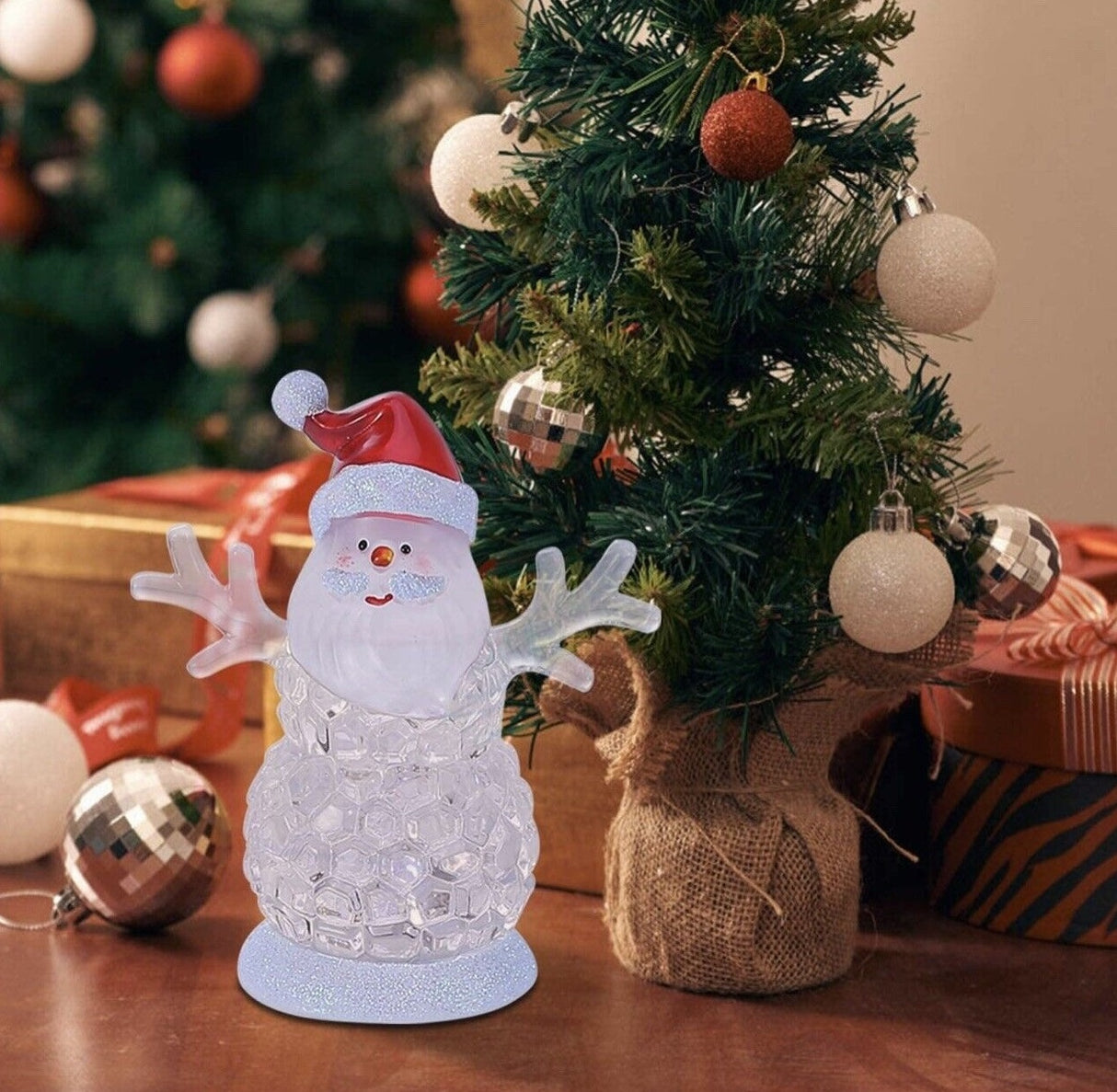 Tabletop decoration shaped like Santa as a snowman.