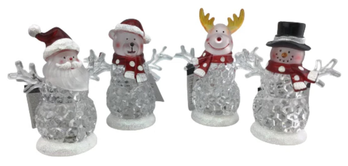 Tabletop decorations shaped like snowmen. One is a Santa "snowman," one is a reindeer "snowman," one is a bear "reindeer" and one is a traditional snowman. The belly of each looks like they're made of ice. There are lights inside that change colors.