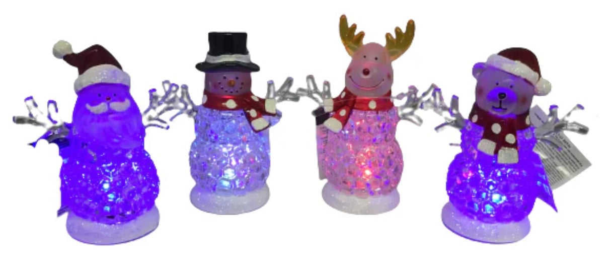 Tabletop decorations shaped like snowmen. One is a Santa "snowman," one is a reindeer "snowman," one is a bear "reindeer" and one is a traditional snowman. The belly of each looks like they're made of ice. There are lights inside that change colors.