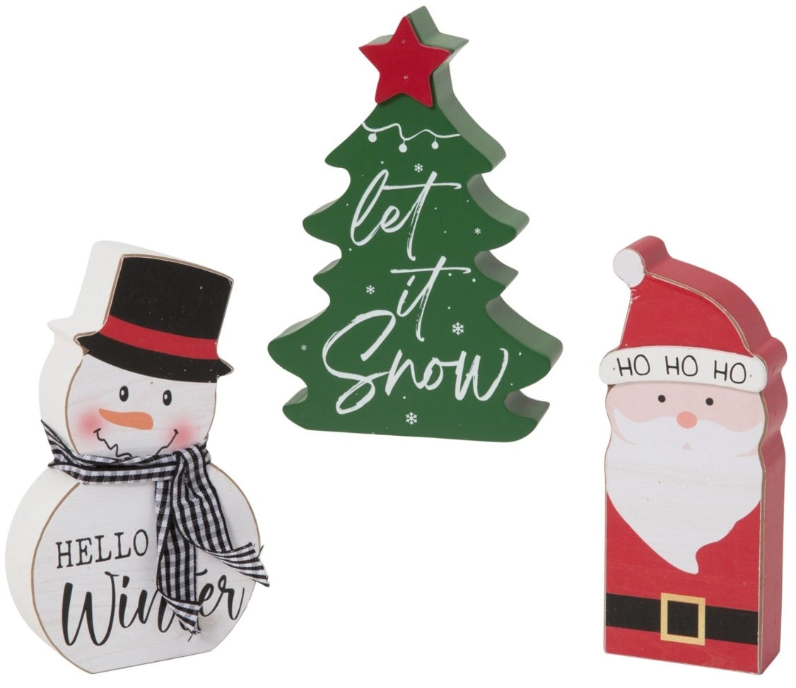 Christmas-themed shelf sitter decoration. One is shaped like a snowman wearing a top hat and reads "Hello Winter." One is shaped like a Christmas tree and reads "Let It Snow." One is shaped like Santa Claus and reads "Ho Ho Ho."