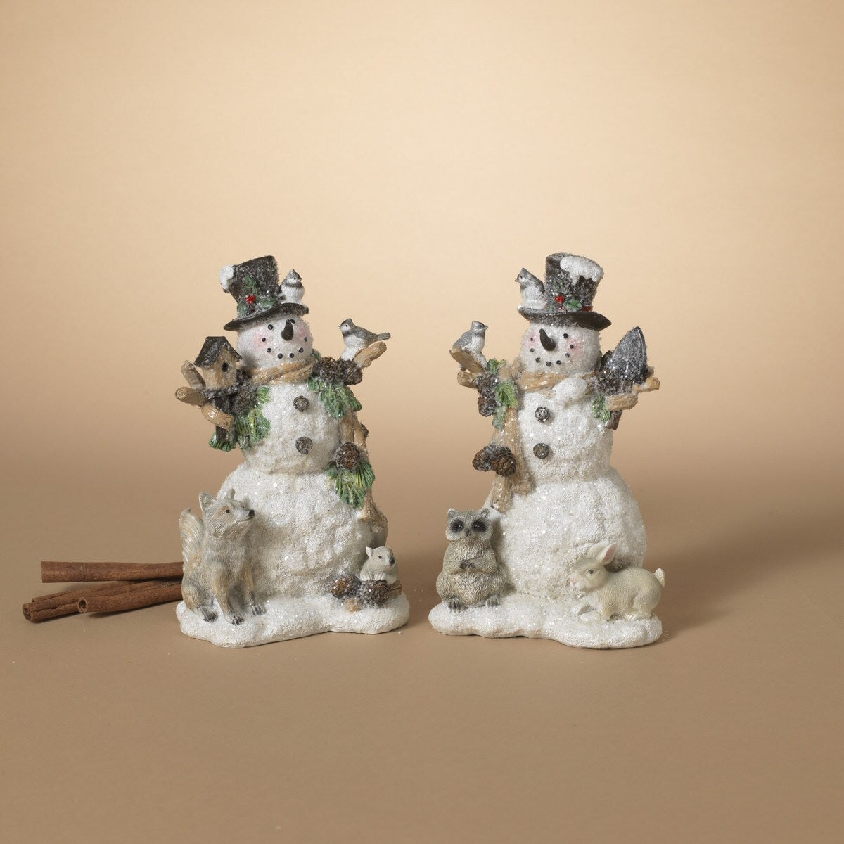 Snowman figurines covered in glitter.
