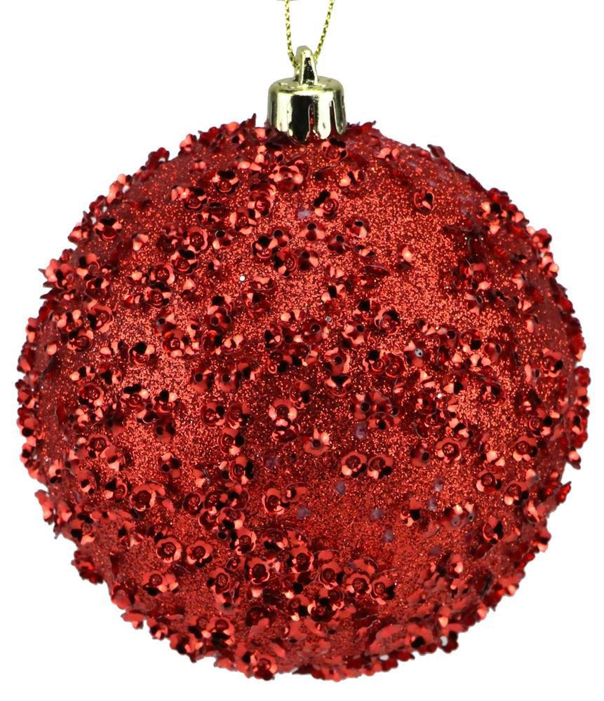 Red sequin glitter ornament hanging from a gold string.