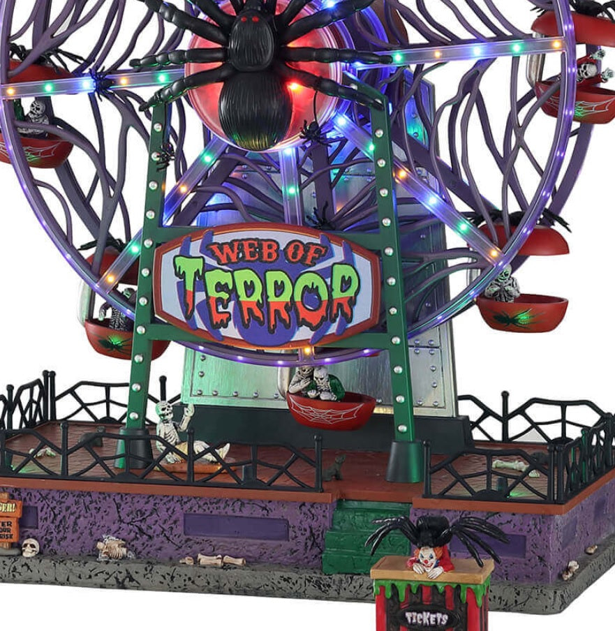 Polyresin carnival ride for a Lemax Spooky Town display. It's a Ferris Wheel that is spider themed. The sign reads "WEB OF TERROR." The pods on the Ferris Wheel are shaped like apples and have a spider on the top of each of them. There's a huge spider in the center of the wheel.