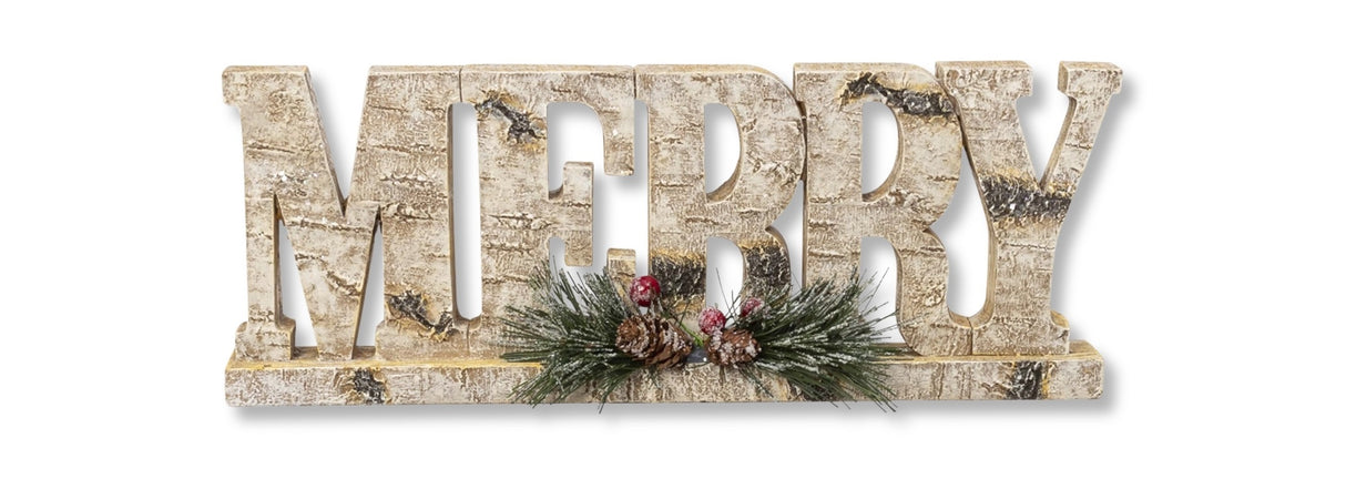 Tabletop decoration that looks like it was carved out of birch wood. This one reads "MERRY" and features pine cone, pine needle and berry accents.