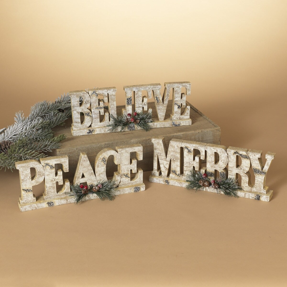 Tabletop decorations that look like they were carved out of birch wood. This picture shows all three options available.