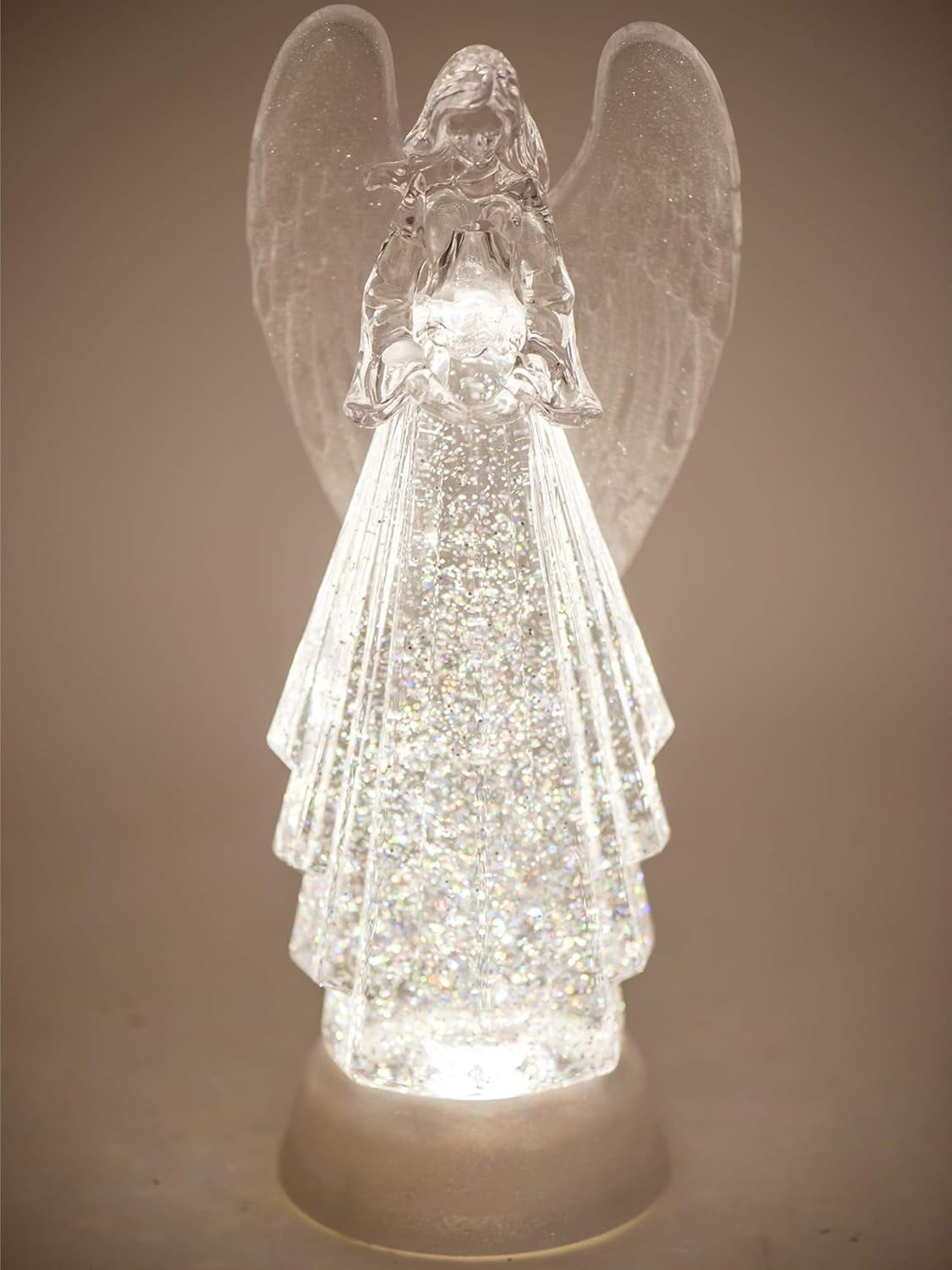 Lighted angel decoration with swirling glitter inside.