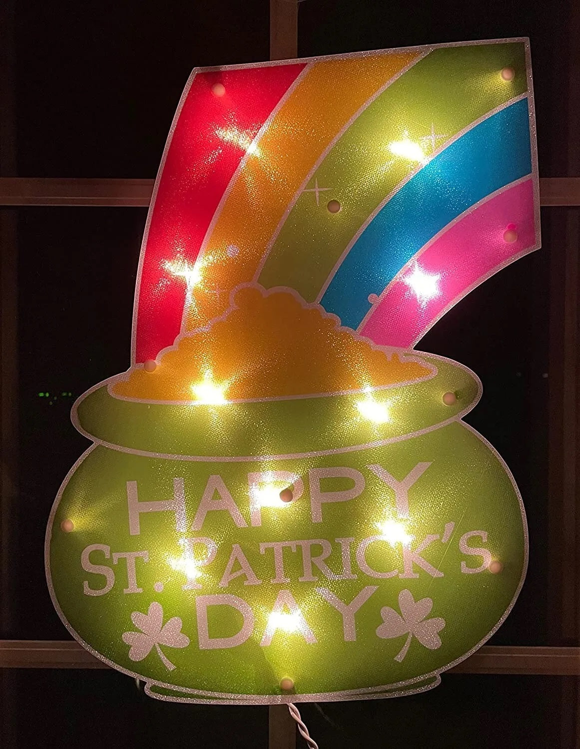 Decoration shaped like a pot of gold with a rainbow coming out of it. On the pot, it reads "Happy St. Patrick's Day!"