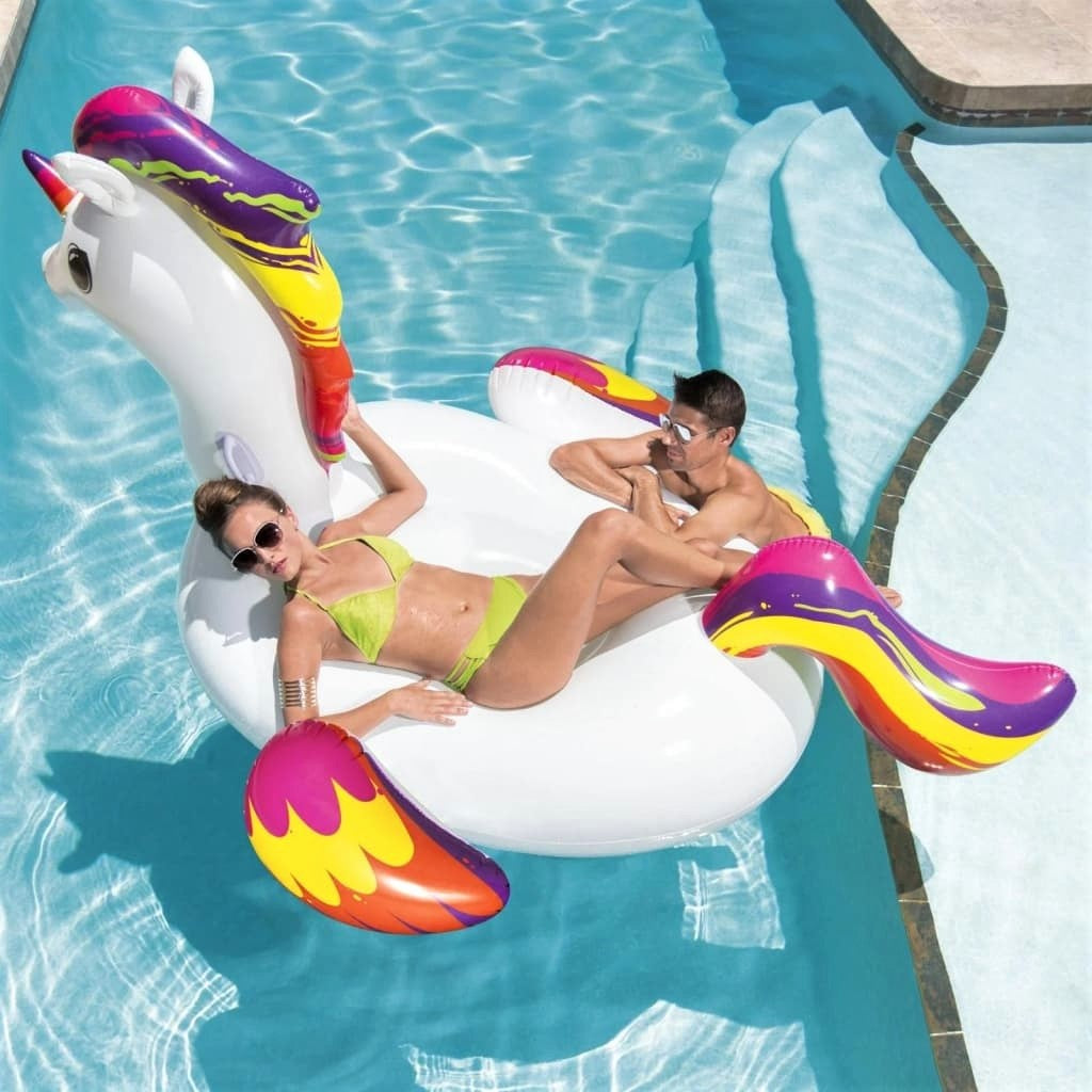 Inflatable pool float shaped like a white and rainbow unicorn.