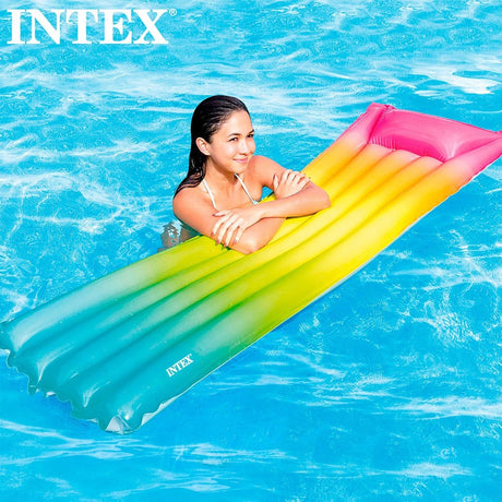 Inflatable pool mattress with an ombre rainbow design.