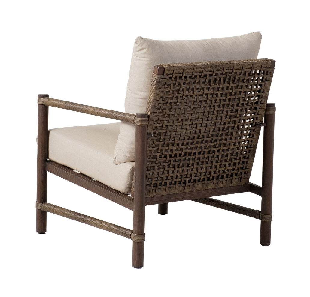 This image shows the back of the lounge chair on a white background. The chair back has an intricate, wicker pattern.