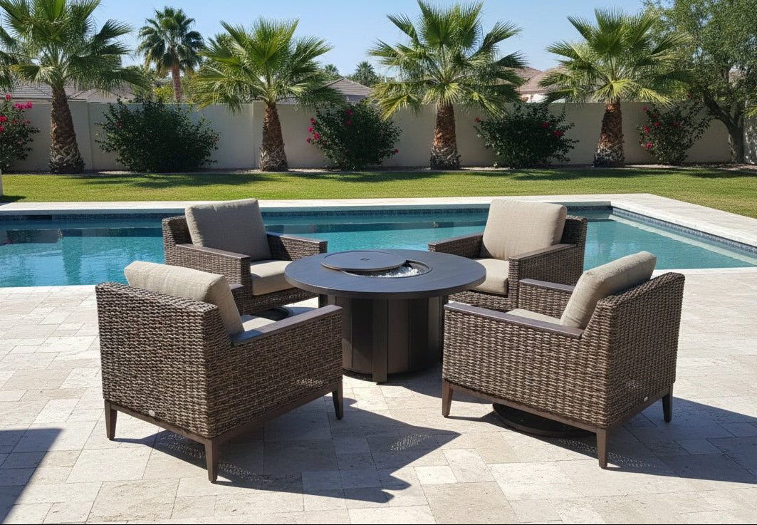 This is a lifestyle image showing this patio furniture set on a stone patio next to an in-ground pool.