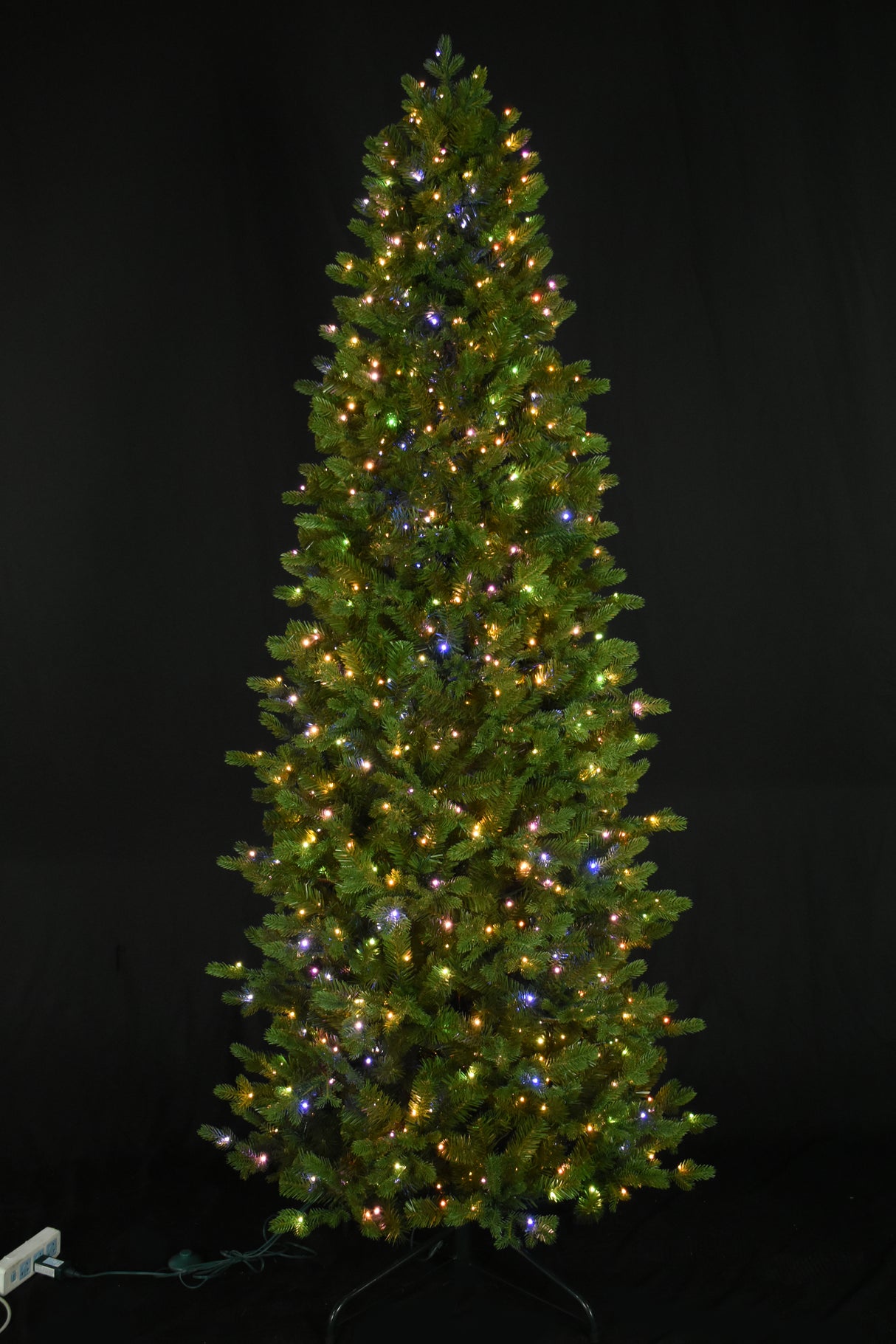 Artificial noble fir tree pre-lit with 750 starry LED lights. The lights can change from warm white to multi-colored.