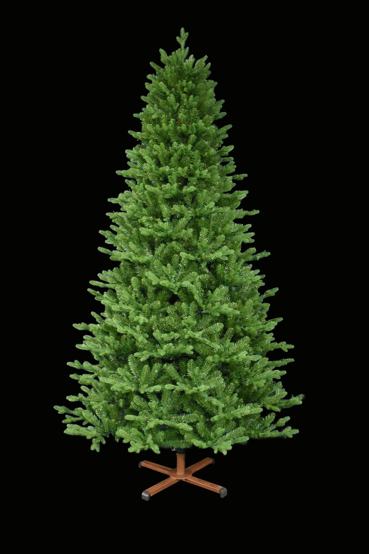 This image shows the tree with the lights turned off. It has a wooden stand. This tree is shown against a white background.