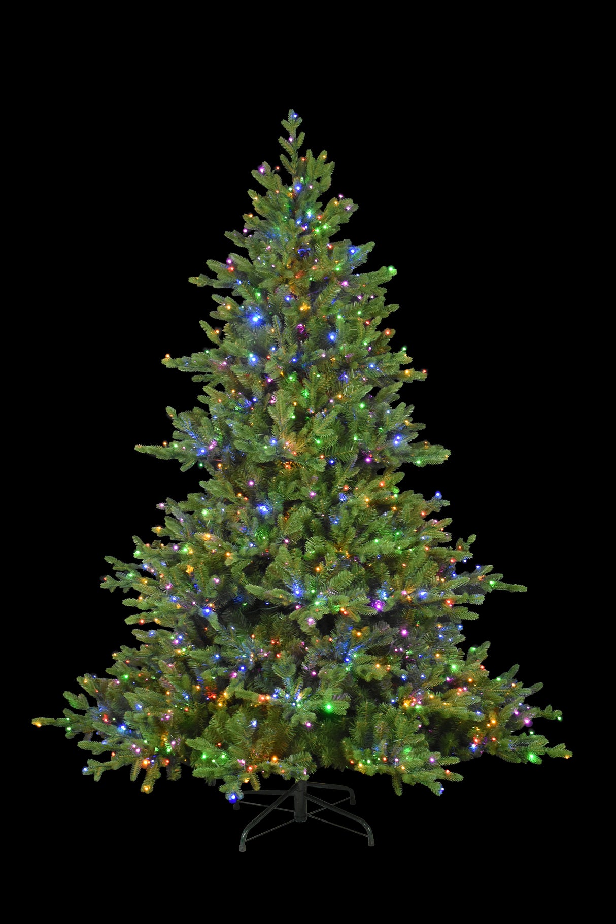 This image shows this specific 7.5 ft. artificial tree pre-lit with Multi-Colored Starry Lights. This tree is up against a black background.