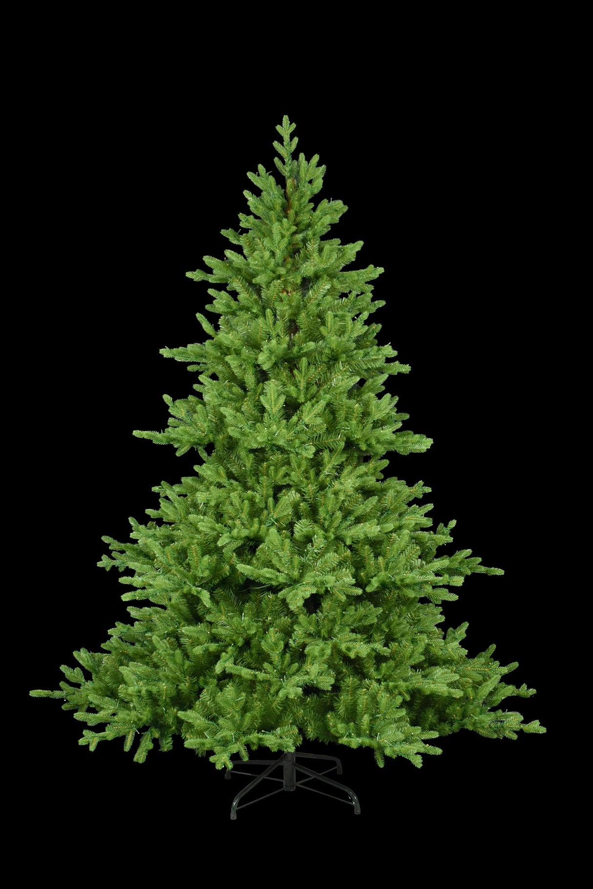 This image shows this specific 7.5 ft. artificial tree with the lights turned off. This tree is up against a black background.