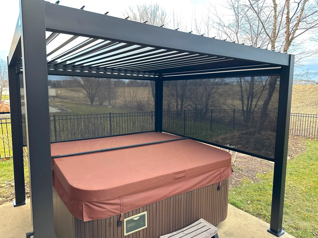 This is a lifestyle image showing the Charcoal gray frame of this Georgetown sun shelter. You can see the moveable slats on the top and the privacy panels on two of the sides. There's a hot tub underneath.