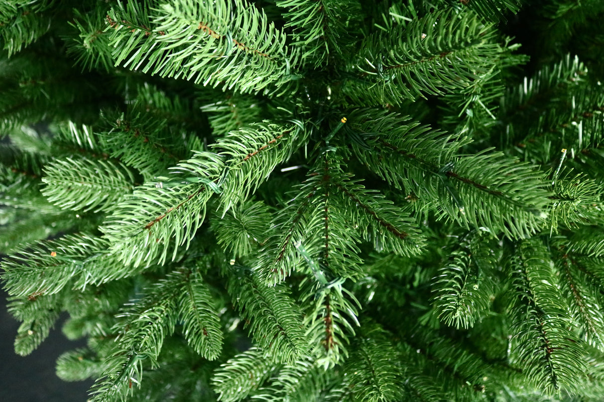Artificial Christmas tree pre-lit with color-changing LED lights.