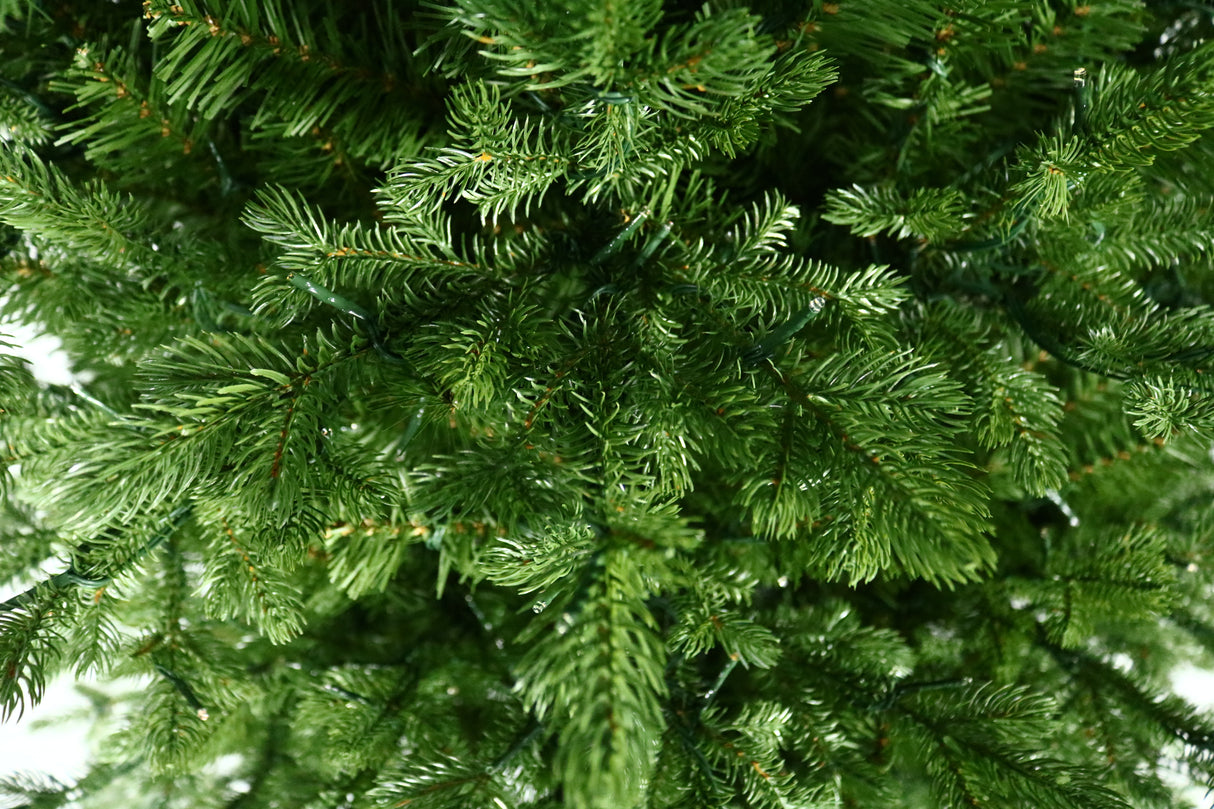 Artificial Christmas tree with color-changing, starry LED lights.