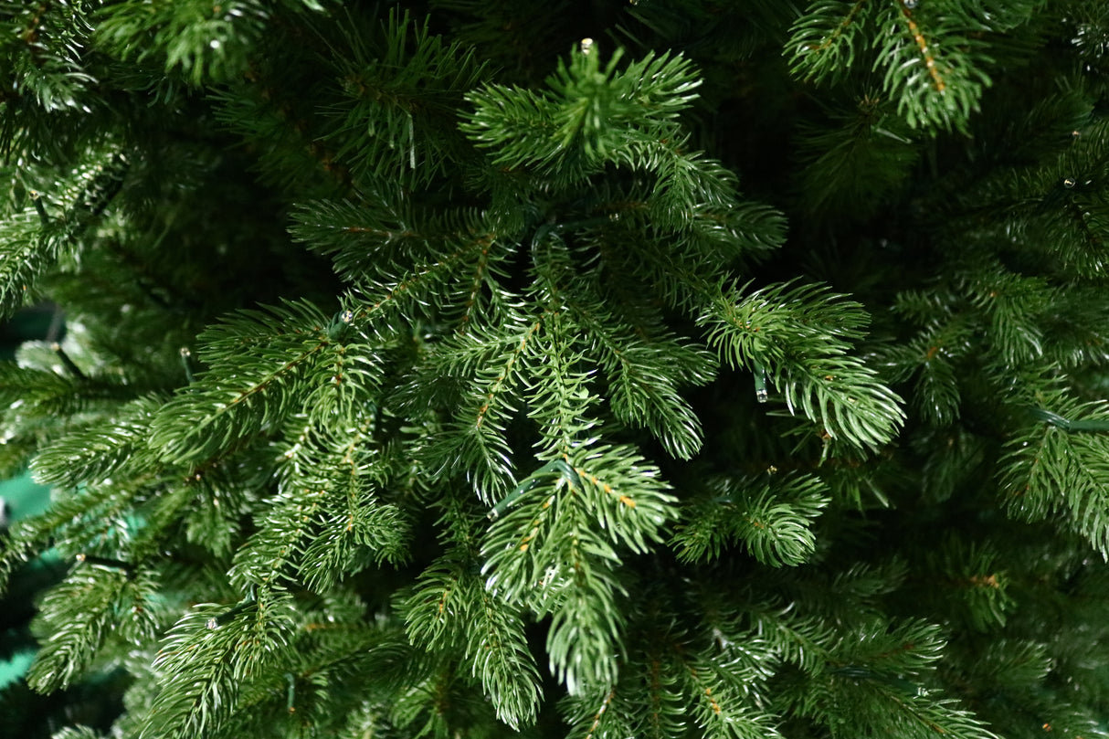 Artificial Christmas tree with color-changing, starry LED lights.