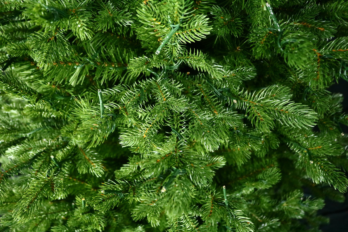 Artificial Christmas tree with color-changing, starry LED lights.