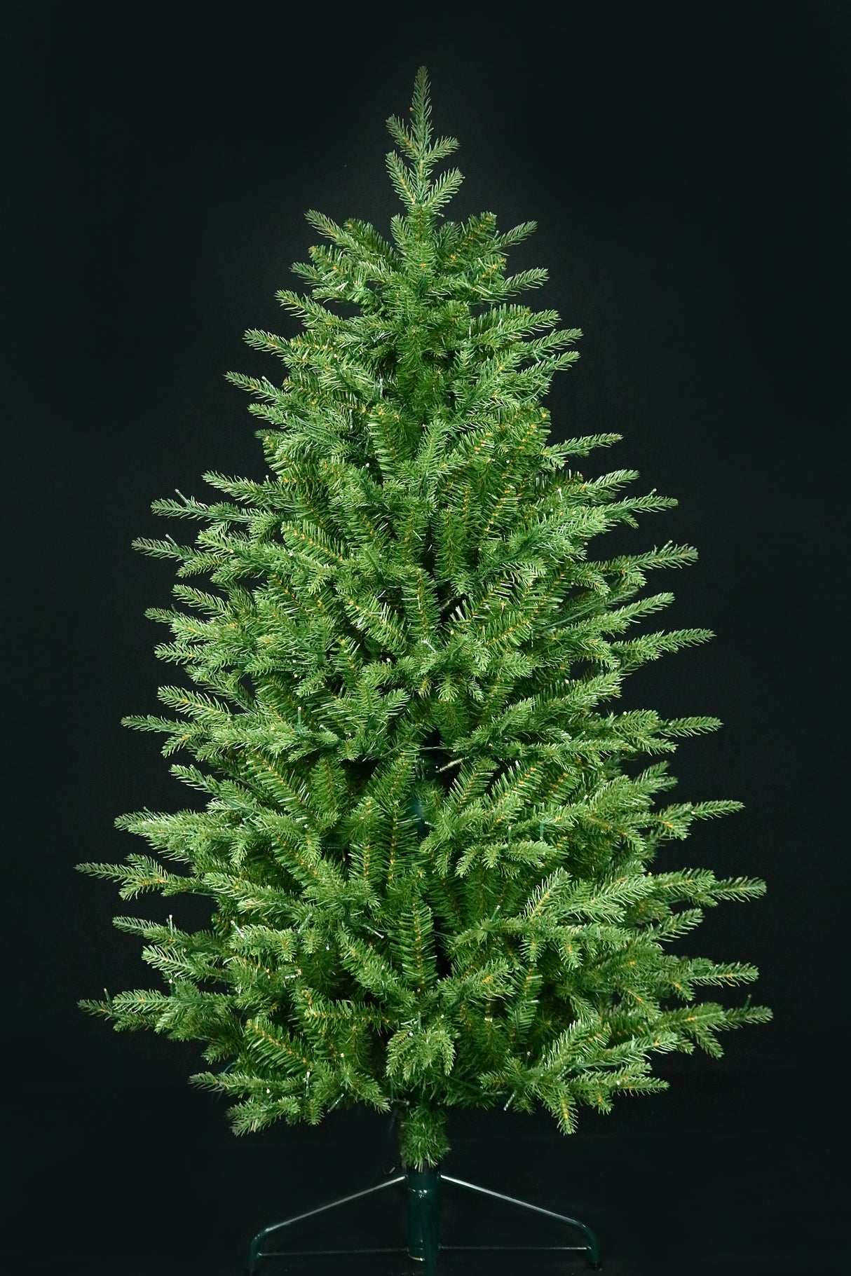 Artificial Christmas tree pre-lit with color-changing LED lights.