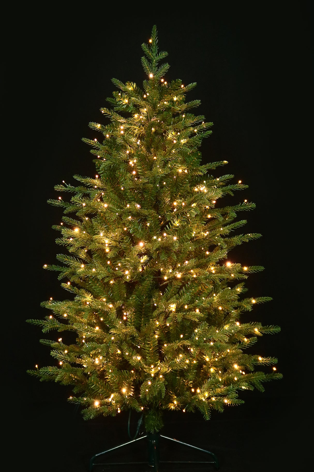 Artificial Christmas tree pre-lit with color-changing LED lights.