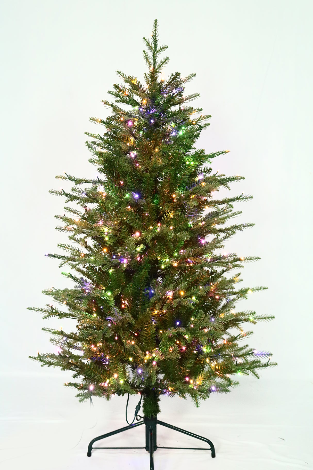 Artificial Christmas tree pre-lit with color-changing LED lights.
