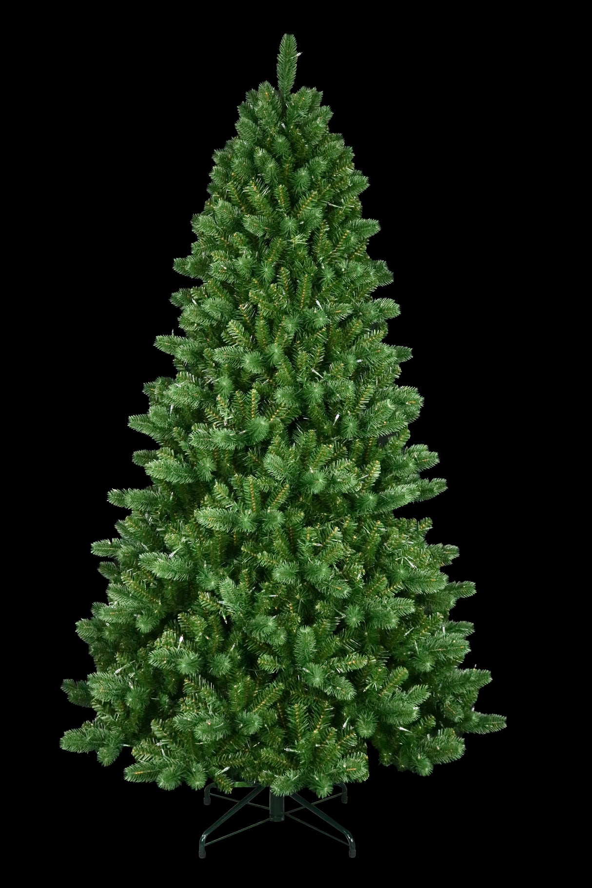 This is an artificial tree with the lights off. This tree is up against a black background.
