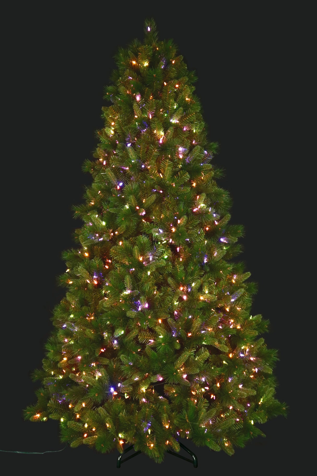 Artificial pine tree pre-lit with color-changing LED lights. In this image, are multi-colored.