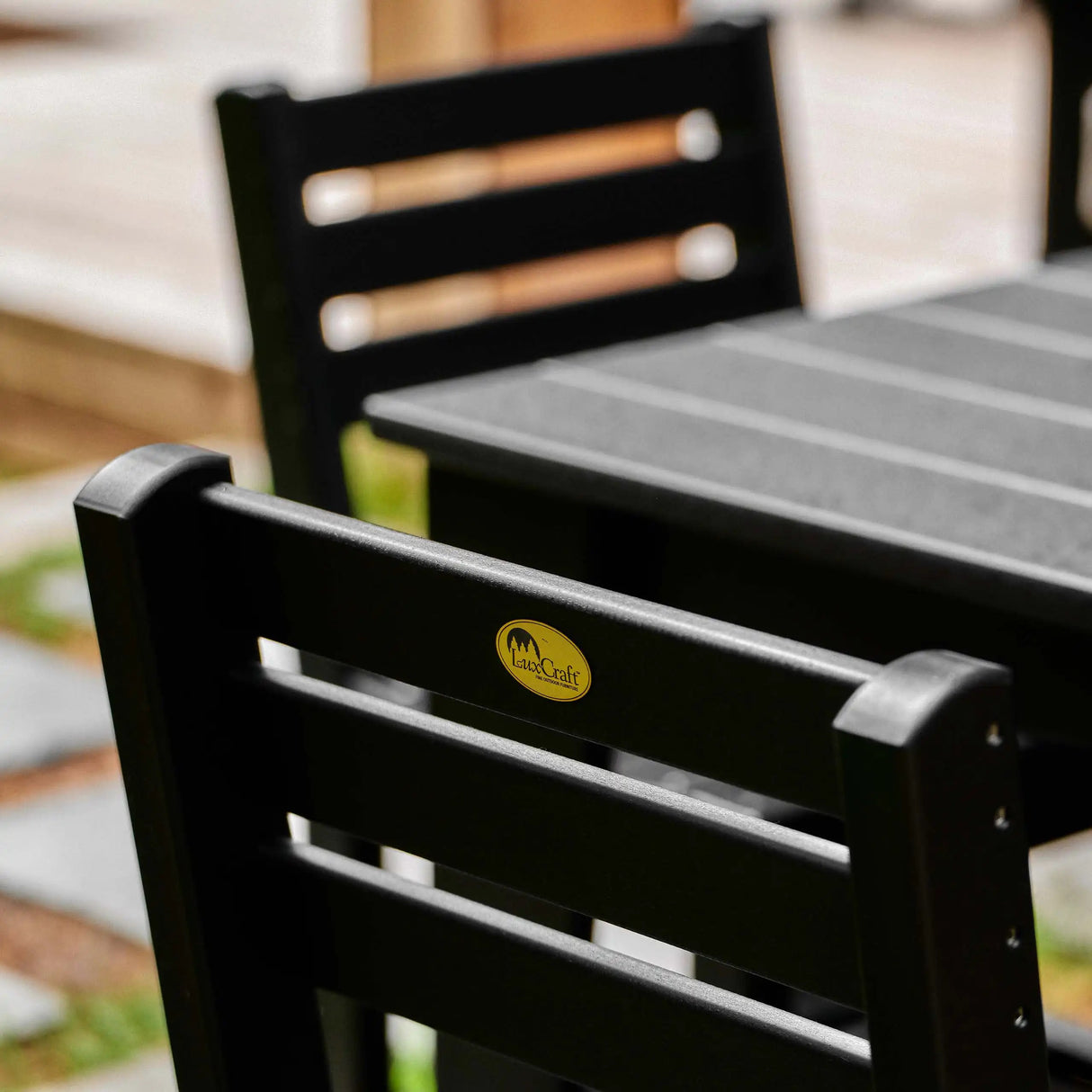 This is a lifestyle image showing an up close view of the Black side chair from the back.
