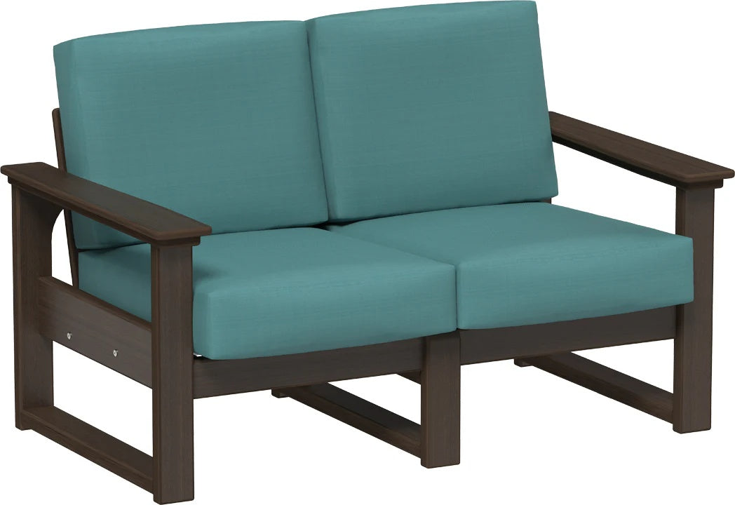 This image shows the deep seating loveseat on a white background. The frames are Brazilian walnut and the cushions are cast breeze.