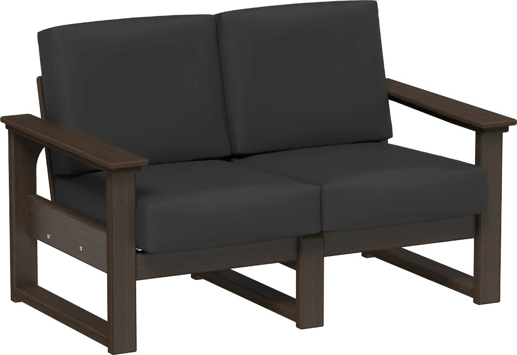 This image shows the deep seating loveseat on a white background. The frames are Brazilian walnut and the cushions are spectrum carbon.
