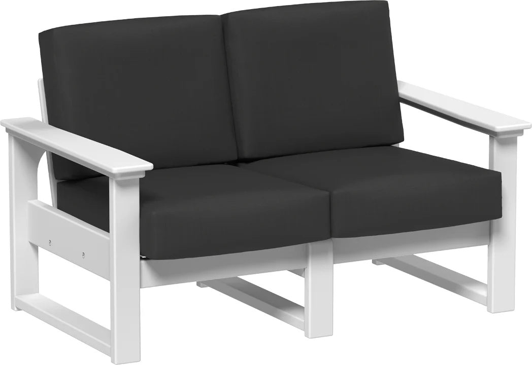 This image shows the deep seating loveseat on a white background. The frames are white and the cushions are spectrum carbon.