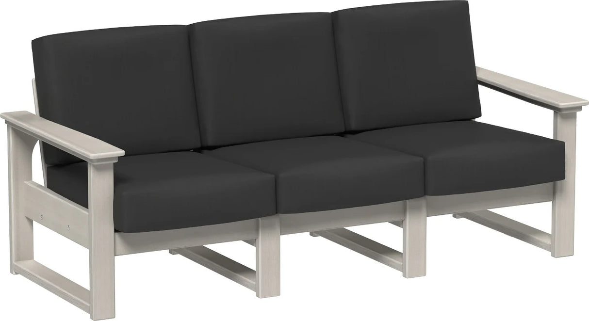 This image shows the deep seating sofa on a white background. The frames are birch and the cushions are spectrum carbon.