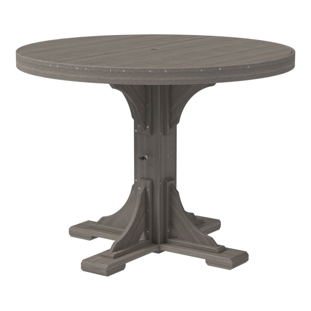 This is the Coastal Gray colored round dining table on a white background.