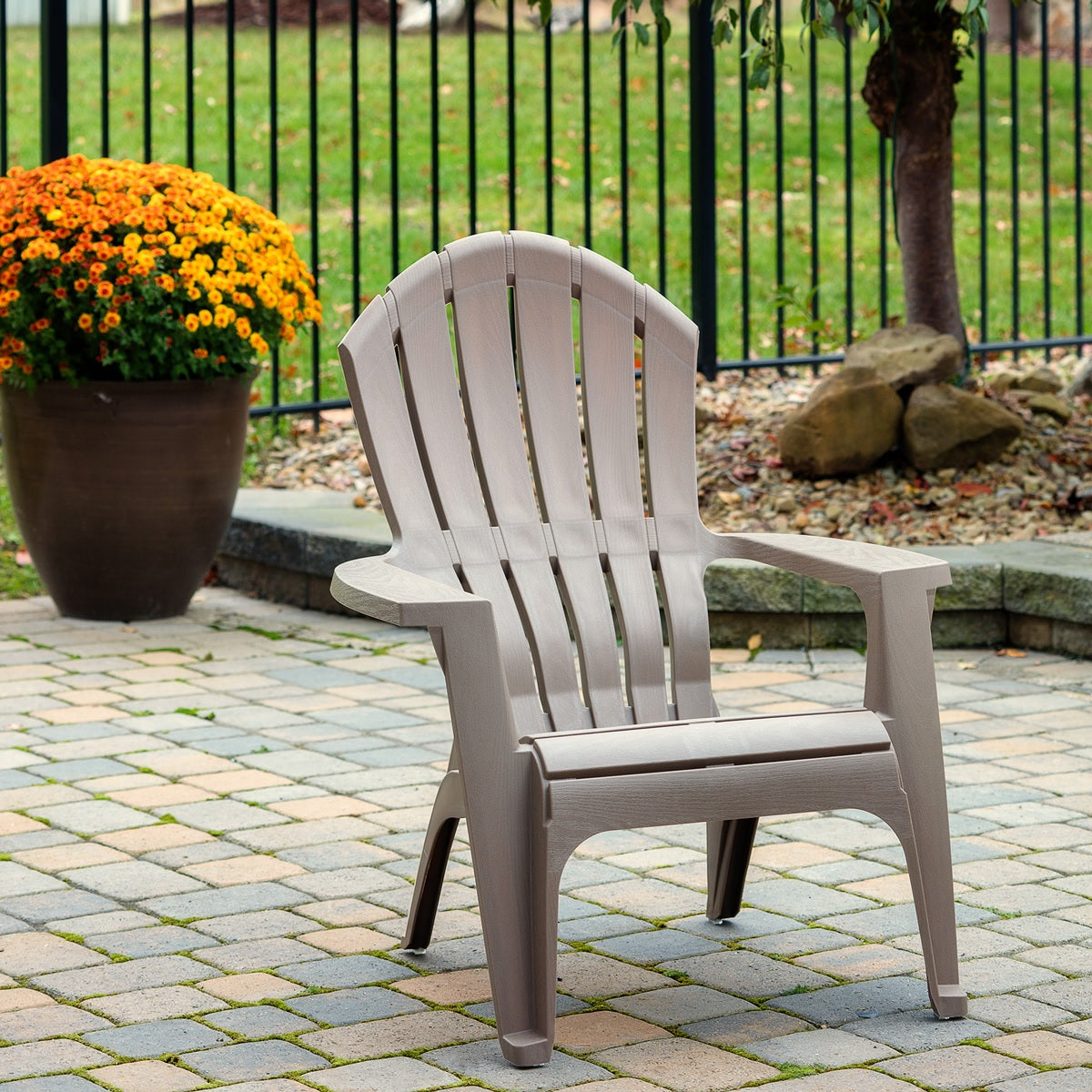 A portobello colored adirondack chair.