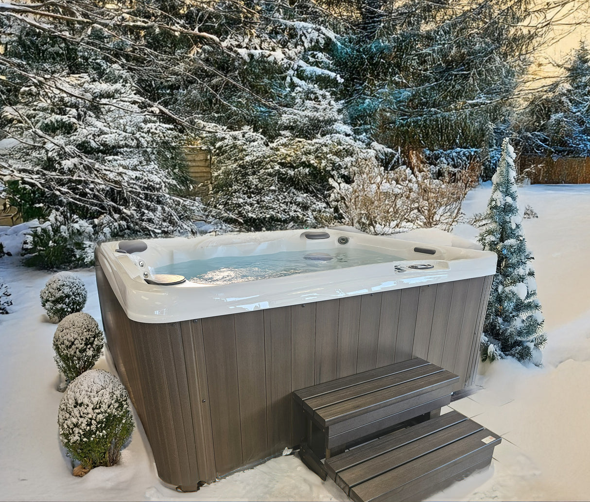 This is a lifestyle image showing this specific hot tub in a snowy, Midwestern backyard.
