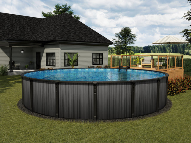 This is a lifestyle image showing what this above ground pool looks like in a grassy yard, up against a pool deck. There's a house off to the side.