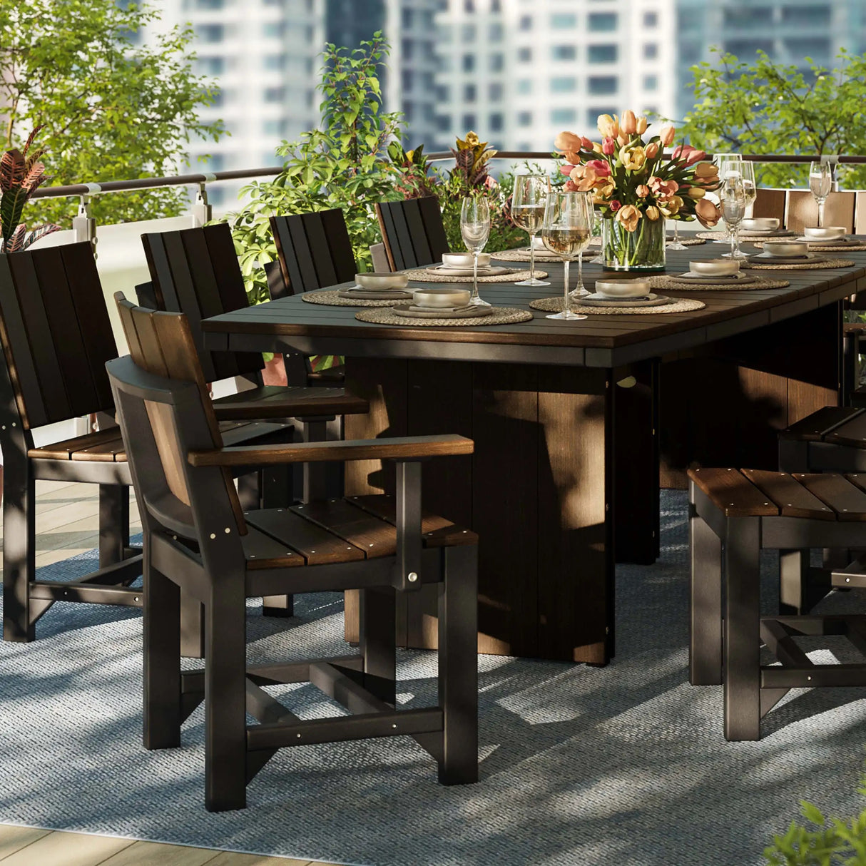 This is a lifestyle image showing 10 Brazilian Walnut and Black colored chairs around a matching table on an outdoor patio.