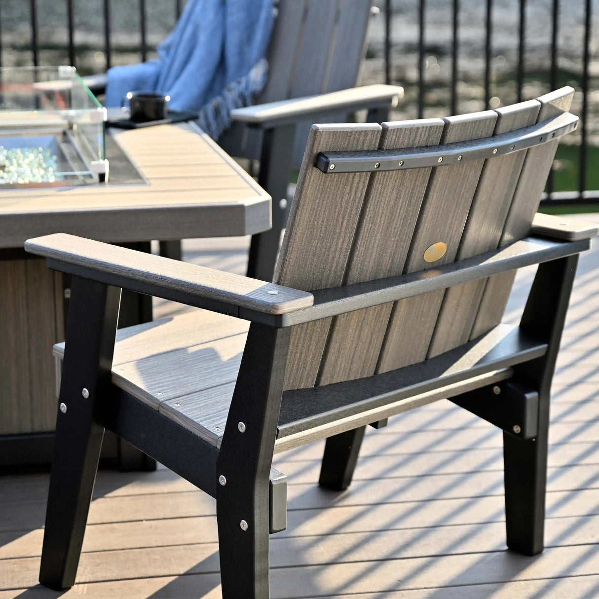 This is a lifestyle image showing the back of one of the Coastal Gray and Black chat chairs.