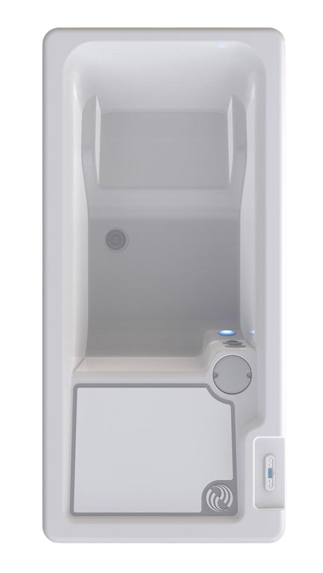 Long, rectangular tub designed for a cold plunge. The cabinet color is a tan-ish gray color and the inside is white. There's one seat. This is a view from above.