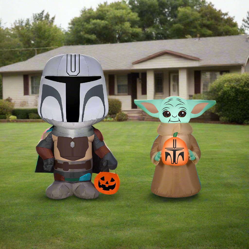 This image shows the two inflatables that come in this bundle. They're set up on the grass in front of a house.