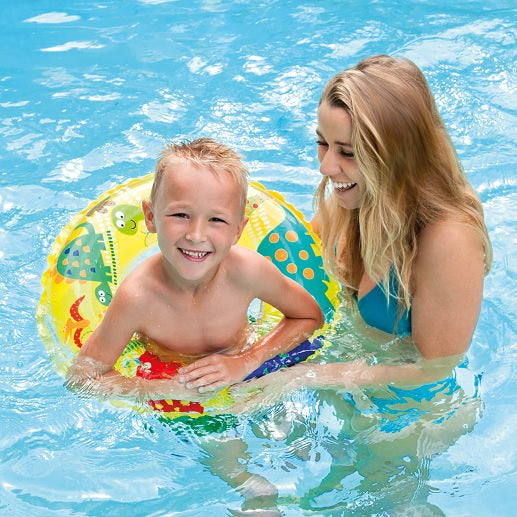 Yellow inflatable with colorful dinosaurs on it.