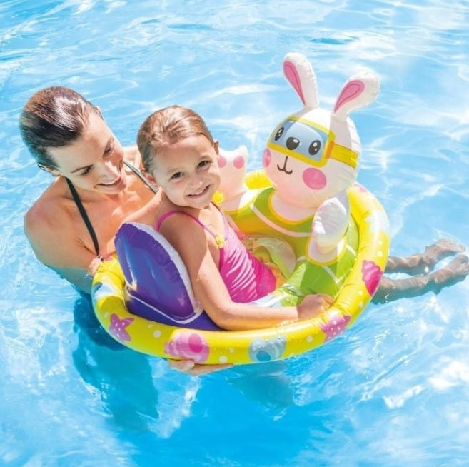 Pool inflatable for kids shaped like a bunny wearing goggles.