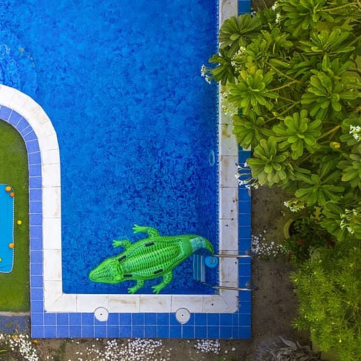 Pool inflatable shaped like an alligator.